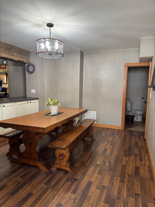 601 Maplewood Dr SE, Pelican Rapids, MN 56572 - dining space with dark wood-style floors and a chandelier