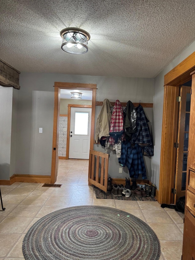 601 Maplewood Dr SE, Pelican Rapids, MN 56572 - mudroom with baseboards and a textured ceiling