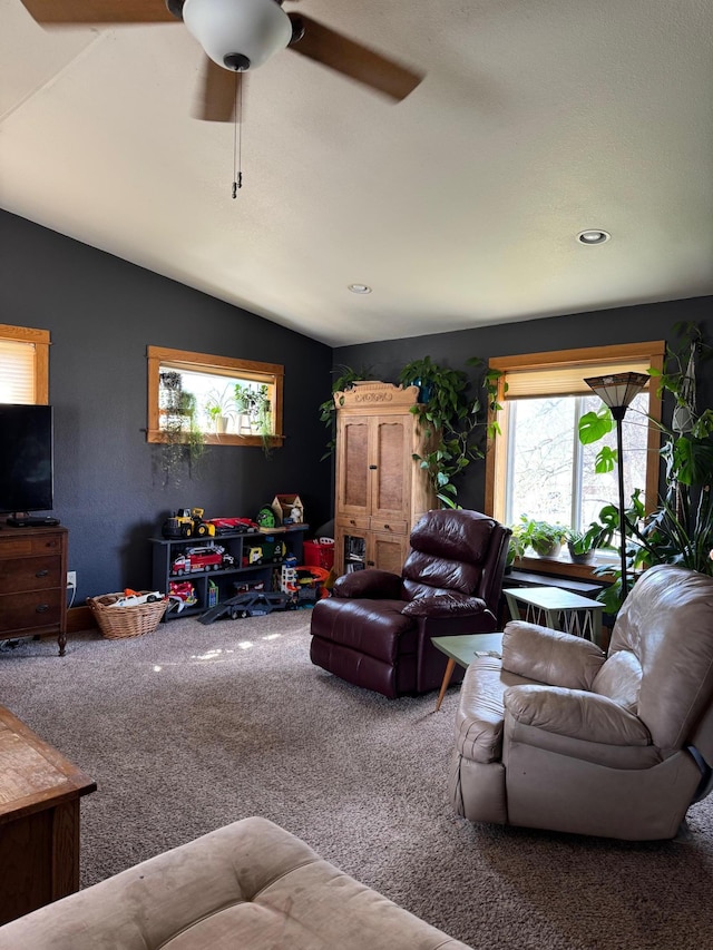 601 Maplewood Dr SE, Pelican Rapids, MN 56572 - living area featuring carpet floors, a ceiling fan, vaulted ceiling, and recessed lighting