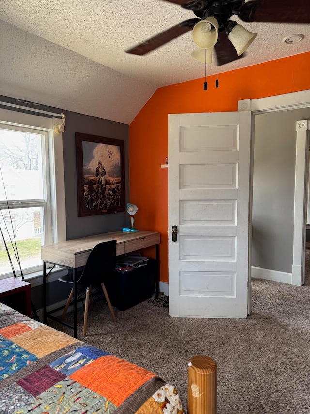 601 Maplewood Dr SE, Pelican Rapids, MN 56572 - carpeted bedroom featuring vaulted ceiling, baseboards, a textured ceiling, and ceiling fan