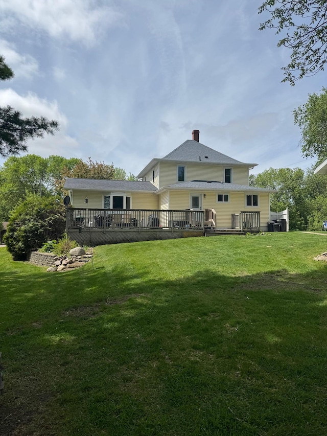 601 Maplewood Dr SE, Pelican Rapids, MN 56572 - rear view of property featuring a chimney, a yard, and a deck