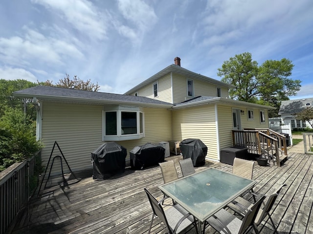 601 Maplewood Dr SE, Pelican Rapids, MN 56572 - wooden deck with outdoor dining area and grilling area