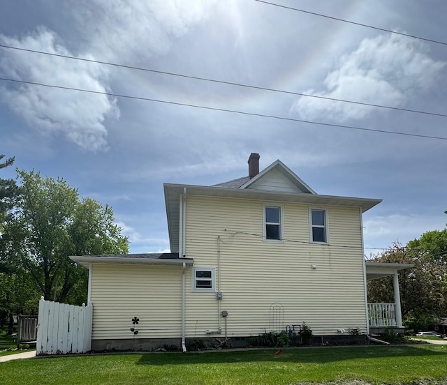 601 Maplewood Dr SE, Pelican Rapids, MN 56572 - view of home's exterior with a lawn and a chimney