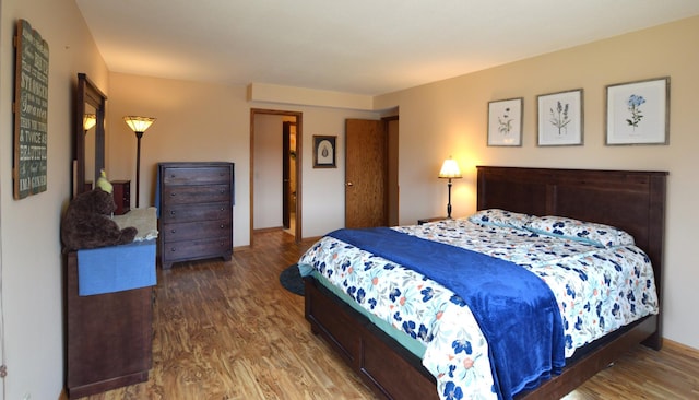 bedroom with wood finished floors