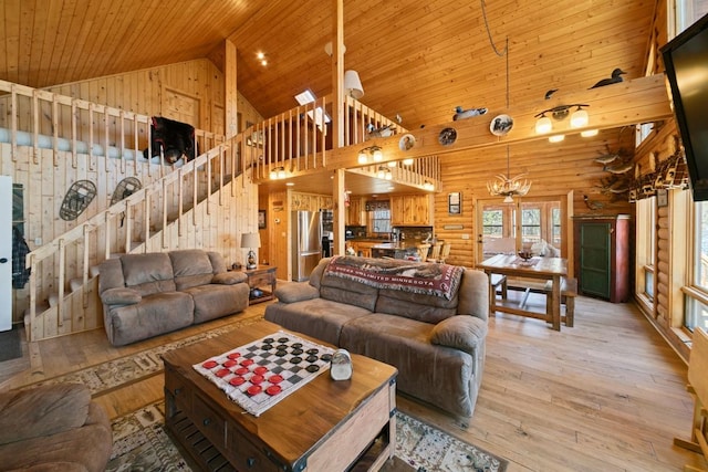 2746 Swift Ln NW, Hackensack, MN 56452 - living area featuring high vaulted ceiling, stairway, wooden ceiling, light wood-style flooring, and a chandelier