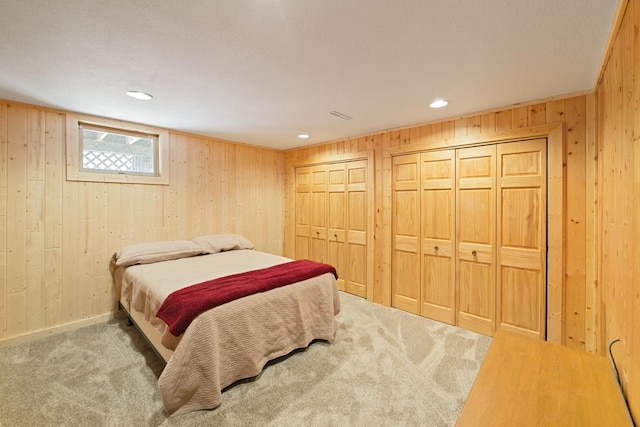 2746 Swift Ln NW, Hackensack, MN 56452 - carpeted bedroom featuring wooden walls, multiple closets, and recessed lighting