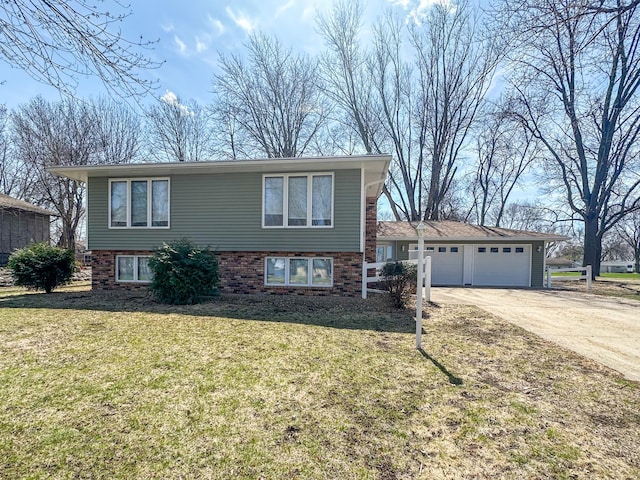 view of front of home with a garage, driveway, and a front lawn