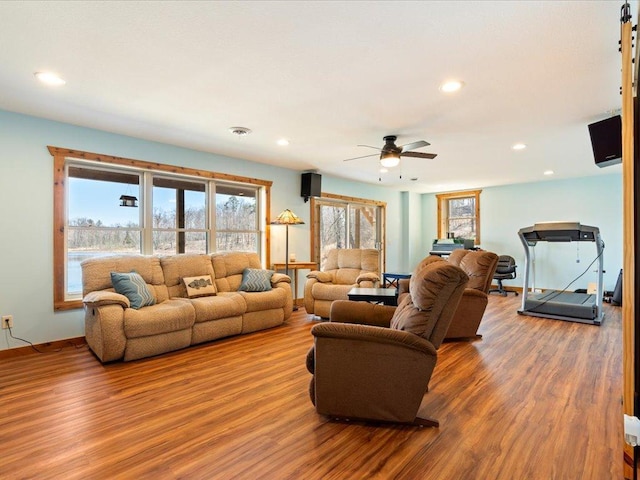 living room featuring ceiling fan, recessed lighting, baseboards, wood finished floors, and visible vents