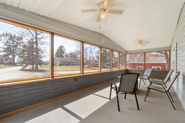 sunroom / solarium featuring ceiling fan