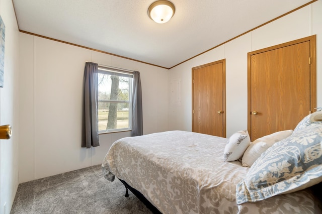 bedroom with carpet flooring, crown molding, and vaulted ceiling