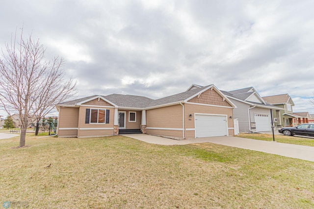 view of front of home with concrete driveway, a front lawn, and a garage