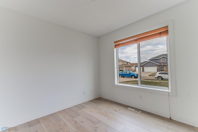 3463 Loberg Dr, West Fargo, ND 58078 - empty room featuring baseboards and light wood finished floors