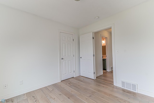 3463 Loberg Dr, West Fargo, ND 58078 - unfurnished bedroom with light wood-style floors and baseboards