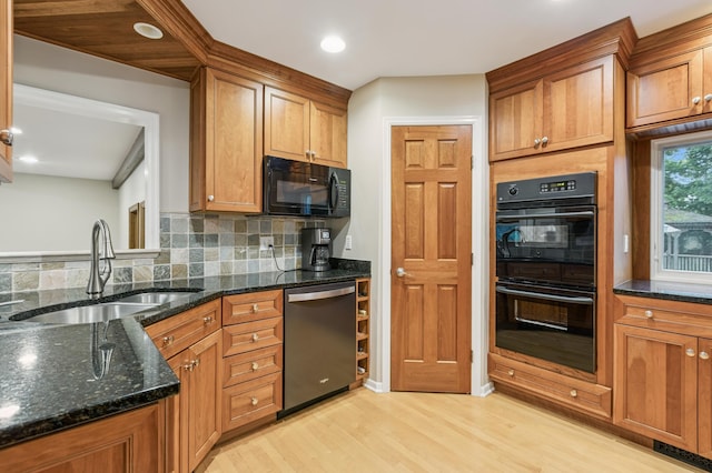 15325 Holdridge Dr E, Minnetonka, MN 55391 - kitchen with black appliances, light wood-style flooring, decorative backsplash, brown cabinetry, and recessed lighting