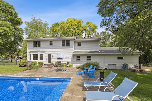 15325 Holdridge Dr E, Minnetonka, MN 55391 - rear view of property with a patio, a chimney, and entry steps