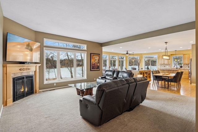 5320 132nd St W, Apple Valley, MN 55124 - living area featuring recessed lighting, a healthy amount of sunlight, and a fireplace with flush hearth