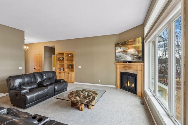 5320 132nd St W, Apple Valley, MN 55124 - carpeted living area with a fireplace with flush hearth, visible vents, and baseboards