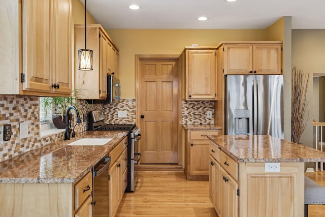 5320 132nd St W, Apple Valley, MN 55124 - kitchen featuring recessed lighting, stainless steel appliances, light brown cabinets, light stone counters, and light wood-style flooring