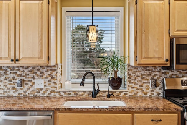 5320 132nd St W, Apple Valley, MN 55124 - kitchen featuring appliances with stainless steel finishes, light brown cabinets, backsplash, and a sink