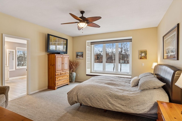 5320 132nd St W, Apple Valley, MN 55124 - bedroom featuring baseboards, a ceiling fan, light carpet, and ensuite bathroom