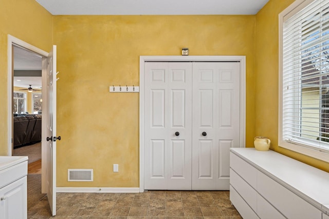 5320 132nd St W, Apple Valley, MN 55124 - bedroom featuring a closet, visible vents, multiple windows, and baseboards
