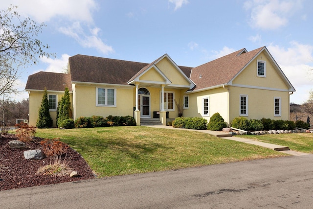 5320 132nd St W, Apple Valley, MN 55124 - view of front of property with a front lawn, stucco siding, and roof with shingles