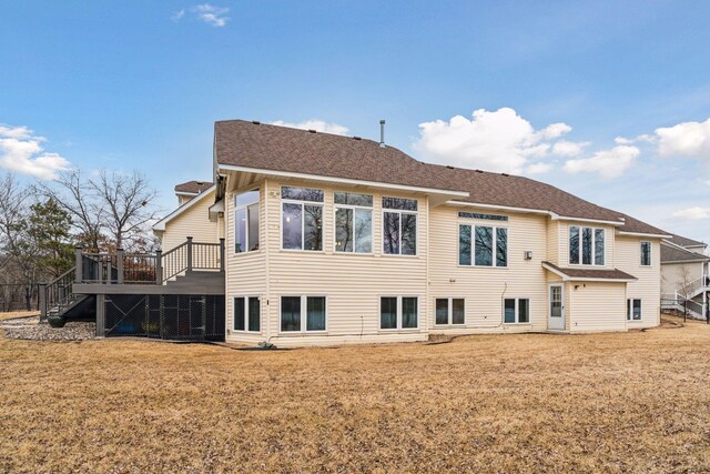 5320 132nd St W, Apple Valley, MN 55124 - rear view of house with roof with shingles, a yard, stairs, and a wooden deck