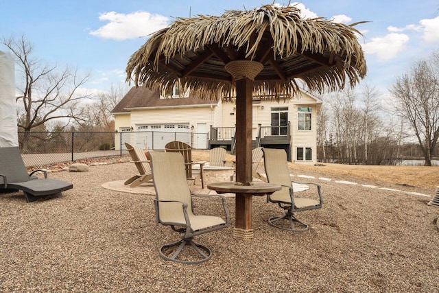 5320 132nd St W, Apple Valley, MN 55124 - view of patio featuring fence and a garage