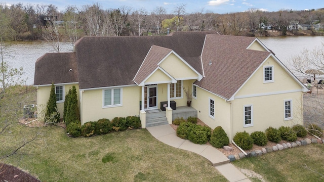 5320 132nd St W, Apple Valley, MN 55124 - view of front of home with stucco siding, a shingled roof, and a front lawn