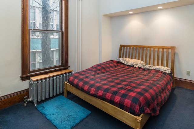 carpeted bedroom featuring recessed lighting and radiator