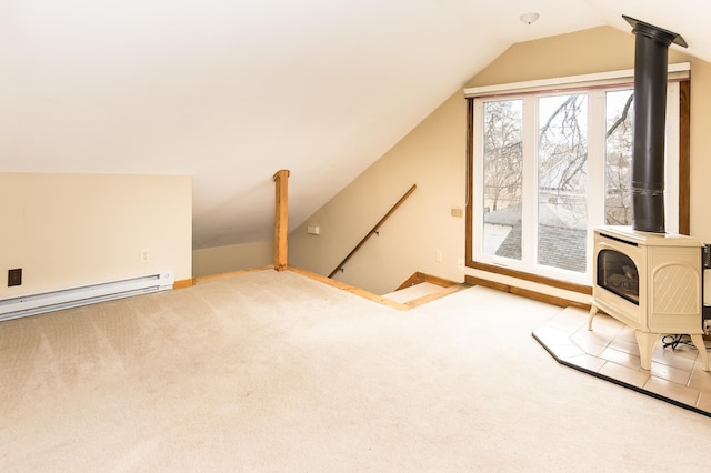 bonus room with a baseboard heating unit, baseboards, carpet, lofted ceiling, and a wood stove