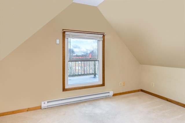 additional living space featuring baseboards, lofted ceiling, baseboard heating, and carpet