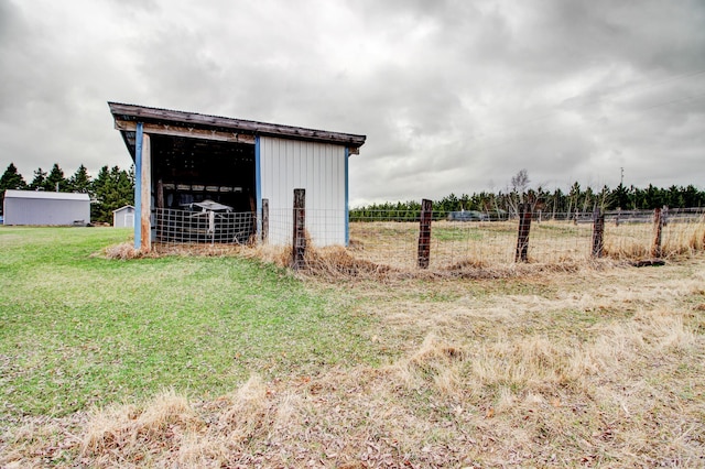 6775 State 87 SW, Backus, MN 56435 - view of pole building featuring fence and a yard