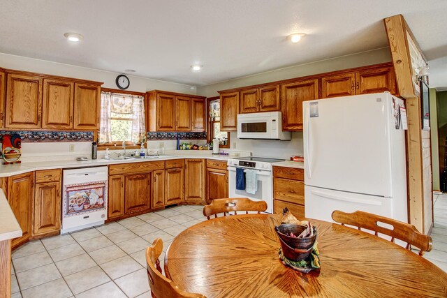 6775 State 87 SW, Backus, MN 56435 - kitchen with a sink, brown cabinets, white appliances, and light countertops