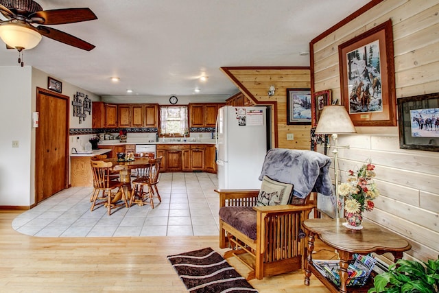 6775 State 87 SW, Backus, MN 56435 - dining room with a ceiling fan, wood walls, and light tile patterned flooring