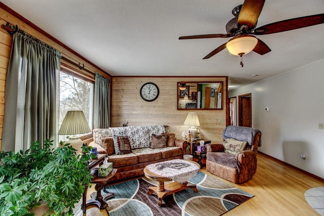 6775 State 87 SW, Backus, MN 56435 - living room with wooden walls, baseboards, a ceiling fan, and wood finished floors