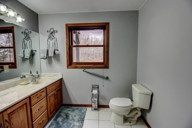 6775 State 87 SW, Backus, MN 56435 - bathroom with vanity, baseboards, tile patterned floors, and toilet