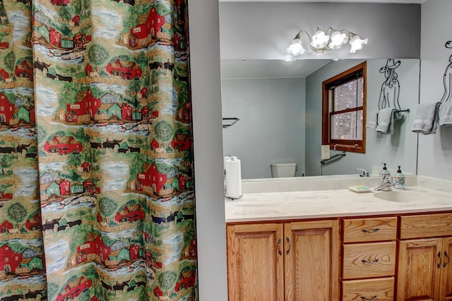 6775 State 87 SW, Backus, MN 56435 - full bathroom featuring vanity, toilet, a chandelier, and a shower with shower curtain