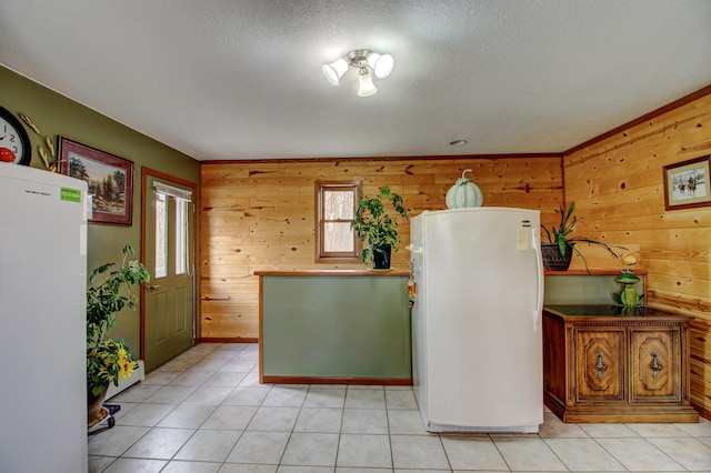 6775 State 87 SW, Backus, MN 56435 - interior space with freestanding refrigerator, wooden walls, and light tile patterned floors
