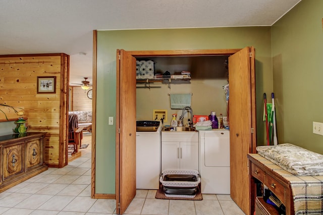 6775 State 87 SW, Backus, MN 56435 - washroom with a sink, light tile patterned floors, laundry area, and washer and clothes dryer