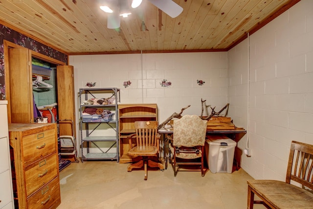 6775 State 87 SW, Backus, MN 56435 - sitting room with concrete block wall, a ceiling fan, ornamental molding, and finished concrete floors