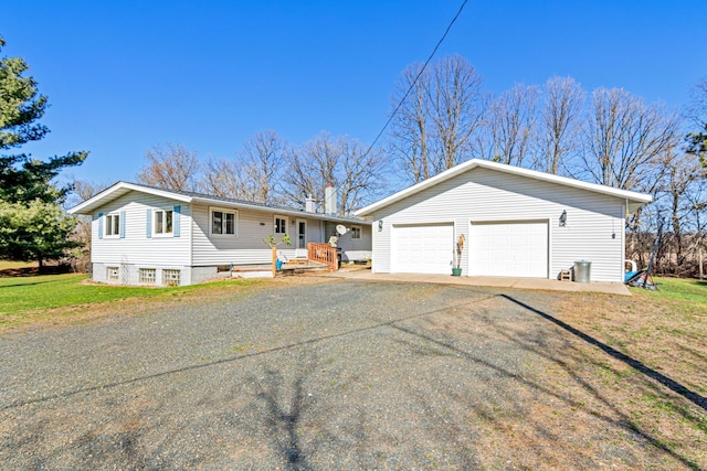 ranch-style house with aphalt driveway, a front yard, an outbuilding, and a chimney