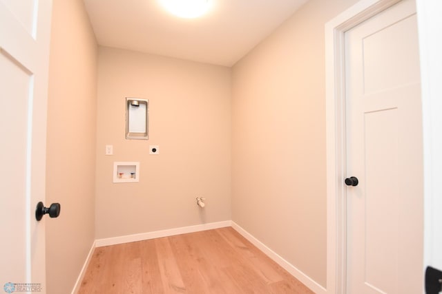 washroom with electric dryer hookup, light wood finished floors, baseboards, and hookup for a washing machine