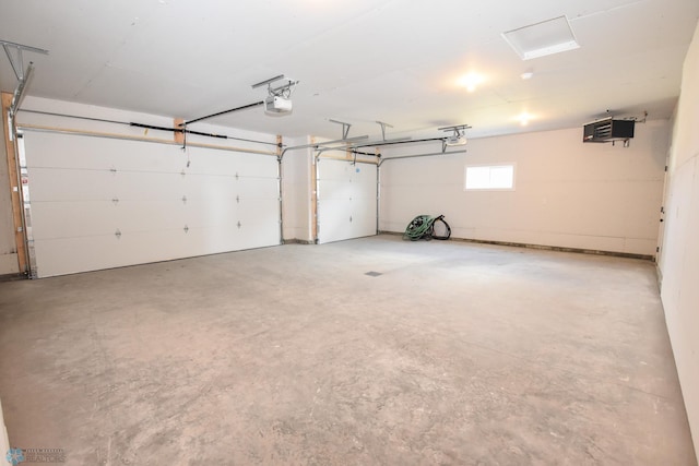 garage featuring a garage door opener
