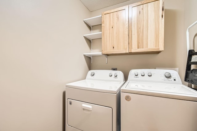 5650 Boone Ave N Unit 315, New Hope, MN 55428 - laundry area featuring cabinet space and washer and clothes dryer