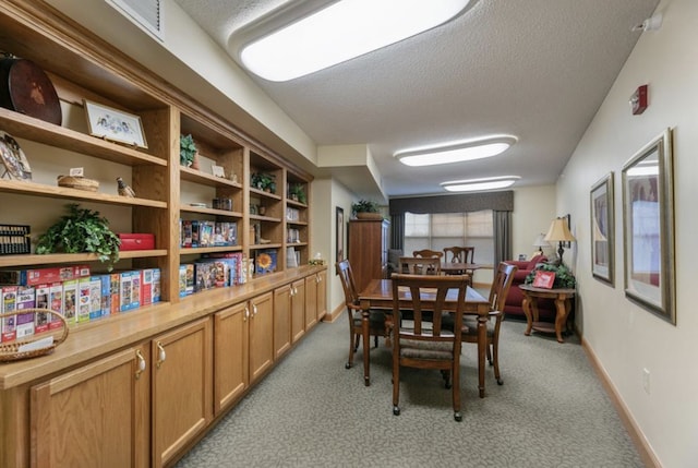 5650 Boone Ave N Unit 315, New Hope, MN 55428 - dining space with a textured ceiling and light carpet