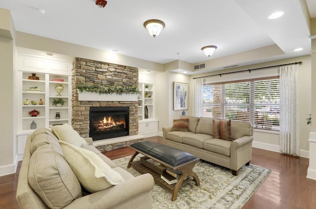 5650 Boone Ave N Unit 315, New Hope, MN 55428 - living area featuring a stone fireplace, wood finished floors, and built in features