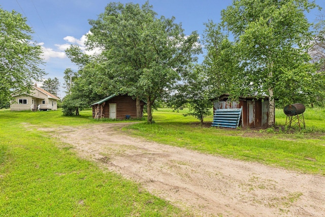 4235 277th Ave NW, Isanti, MN 55040 - view of green lawn featuring an outbuilding