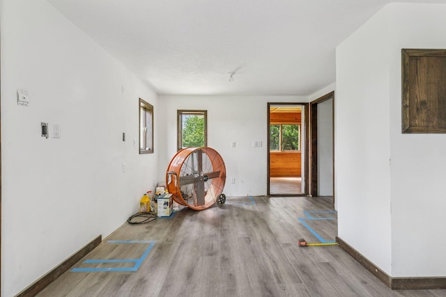 4235 277th Ave NW, Isanti, MN 55040 - unfurnished room with wood finished floors and baseboards