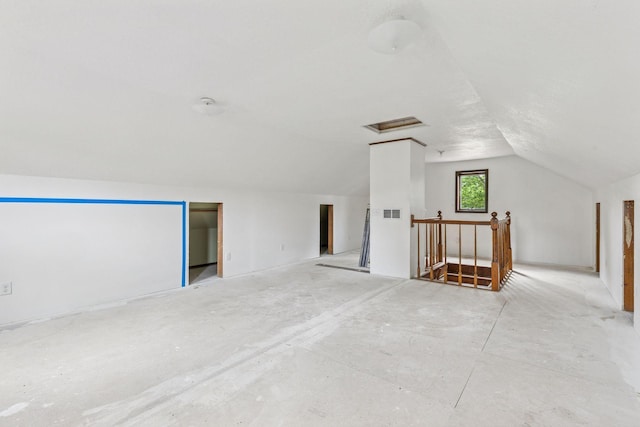 4235 277th Ave NW, Isanti, MN 55040 - unfurnished room with lofted ceiling and attic access